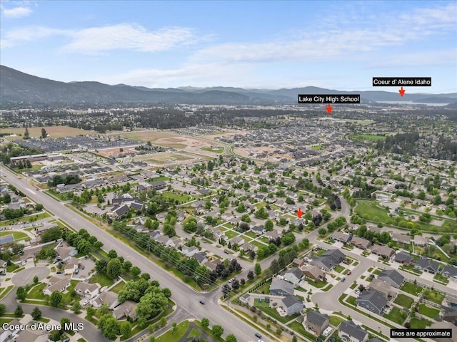 2574 W Sarge Ct, Coeur Dalene, ID 83815 - aerial overview of property's location with mountains and nearby suburban area
