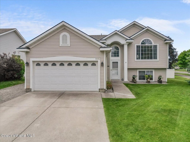 2574 W Sarge Ct, Coeur Dalene, ID 83815 - view of front of house featuring driveway, a front yard, and an attached garage