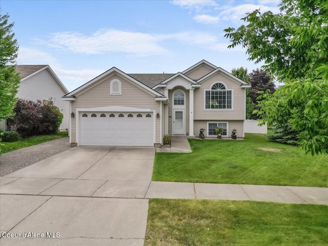 2574 W Sarge Ct, Coeur Dalene, ID 83815 - view of front facade with concrete driveway, a garage, and a front lawn