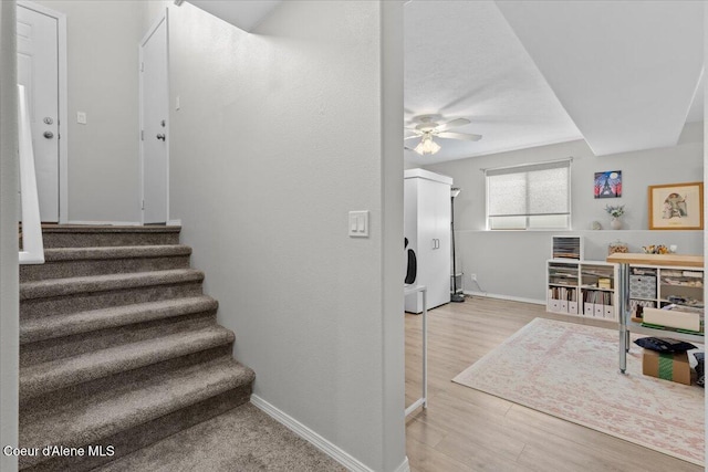 2574 W Sarge Ct, Coeur Dalene, ID 83815 - staircase with ceiling fan, wood finished floors, and baseboards