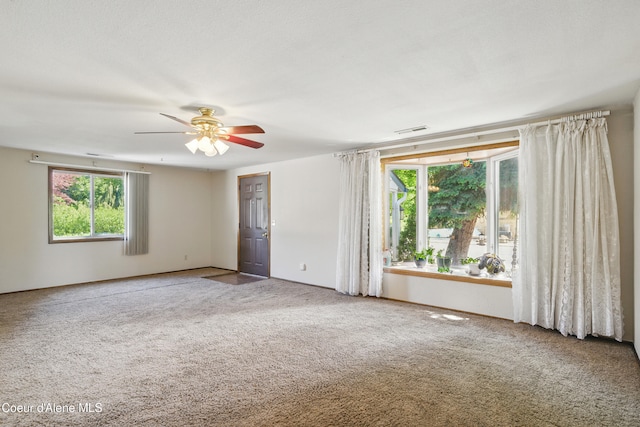 1031 N 11th St, Coeur Dalene, ID 83814 - unfurnished room featuring carpet floors and ceiling fan