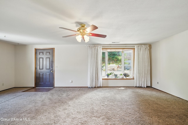 1031 N 11th St, Coeur Dalene, ID 83814 - unfurnished room with carpet, ceiling fan, and baseboards