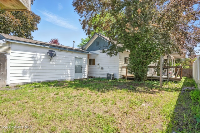 1031 N 11th St, Coeur Dalene, ID 83814 - rear view of property with a deck and central AC unit