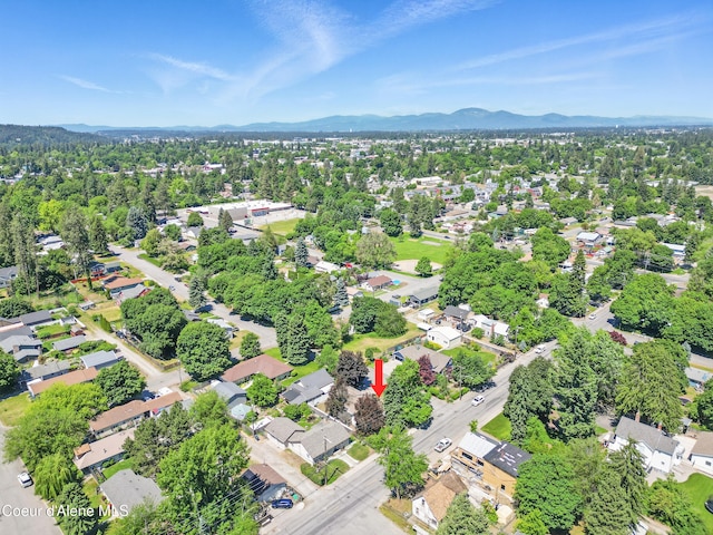 1031 N 11th St, Coeur Dalene, ID 83814 - aerial view of property and surrounding area featuring a mountain backdrop and nearby suburban area