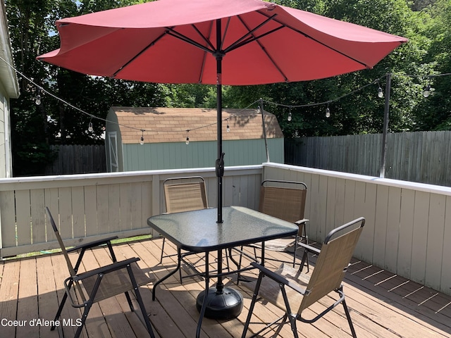705 S Division St, Kellogg, ID 83837 - wooden deck featuring outdoor dining space and a fenced backyard