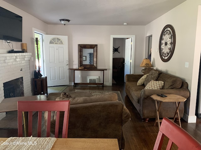 705 S Division St, Kellogg, ID 83837 - living area with wood finished floors, a fireplace, and baseboards