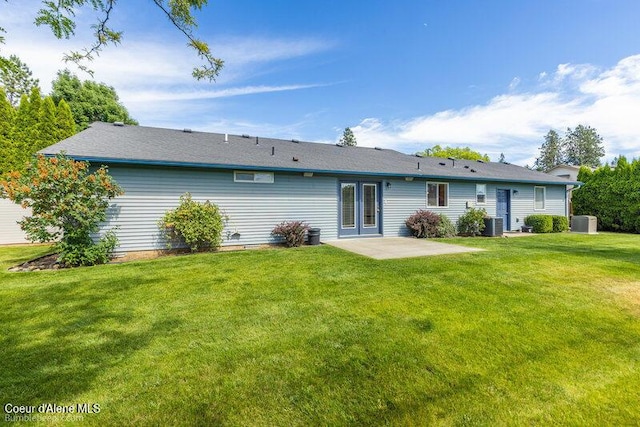 1555 W Benjamin Ave, Coeur Dalene, ID 83815 - back of property featuring a patio area and a yard