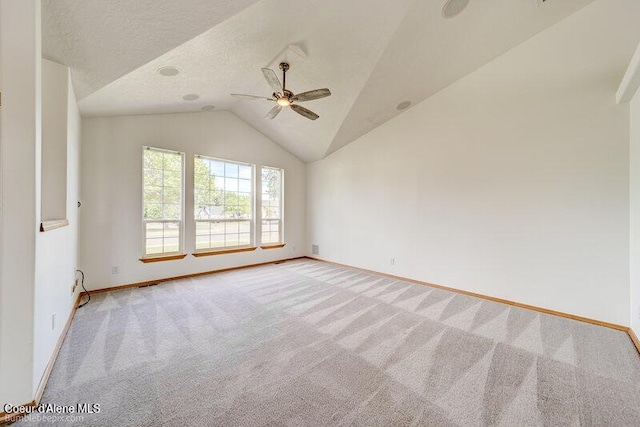 1555 W Benjamin Ave, Coeur Dalene, ID 83815 - unfurnished room with light colored carpet, a ceiling fan, vaulted ceiling, and a textured ceiling