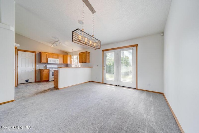 1555 W Benjamin Ave, Coeur Dalene, ID 83815 - unfurnished living room featuring a textured ceiling, light colored carpet, and vaulted ceiling