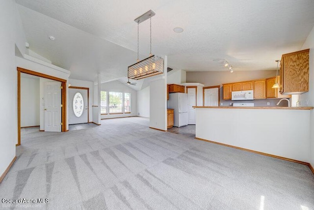 1555 W Benjamin Ave, Coeur Dalene, ID 83815 - unfurnished living room with vaulted ceiling, a ceiling fan, light carpet, and a textured ceiling