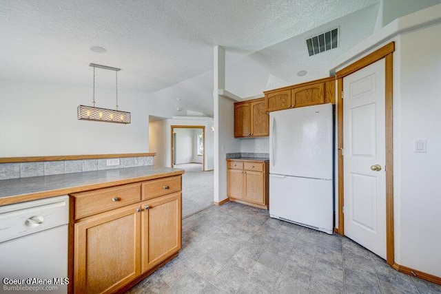 1555 W Benjamin Ave, Coeur Dalene, ID 83815 - kitchen featuring white appliances, lofted ceiling, a textured ceiling, decorative light fixtures, and brown cabinets