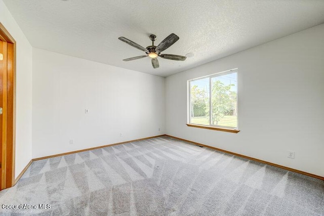 1555 W Benjamin Ave, Coeur Dalene, ID 83815 - unfurnished room with carpet, ceiling fan, and a textured ceiling