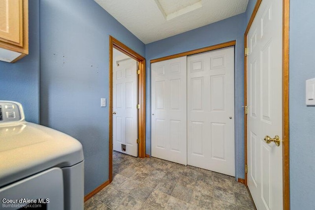 1555 W Benjamin Ave, Coeur Dalene, ID 83815 - laundry area with washer / clothes dryer, cabinet space, and stone finish flooring