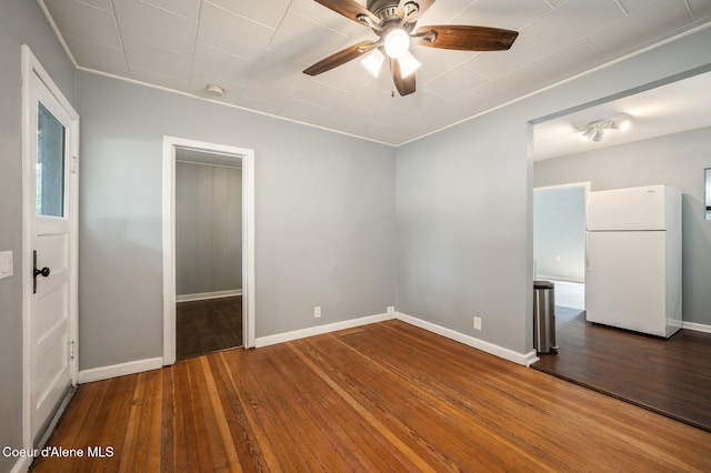 1412/1414 N 13th St, Coeur Dalene, ID 83814 - unfurnished bedroom featuring freestanding refrigerator, wood-type flooring, ornamental molding, and ceiling fan