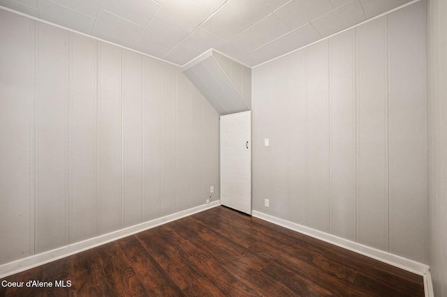 1412/1414 N 13th St, Coeur Dalene, ID 83814 - bonus room with dark wood-style floors, a decorative wall, and lofted ceiling