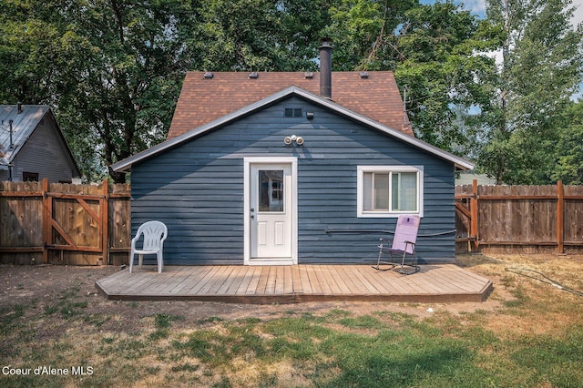 1412/1414 N 13th St, Coeur Dalene, ID 83814 - back of property with a fenced backyard and a wooden deck