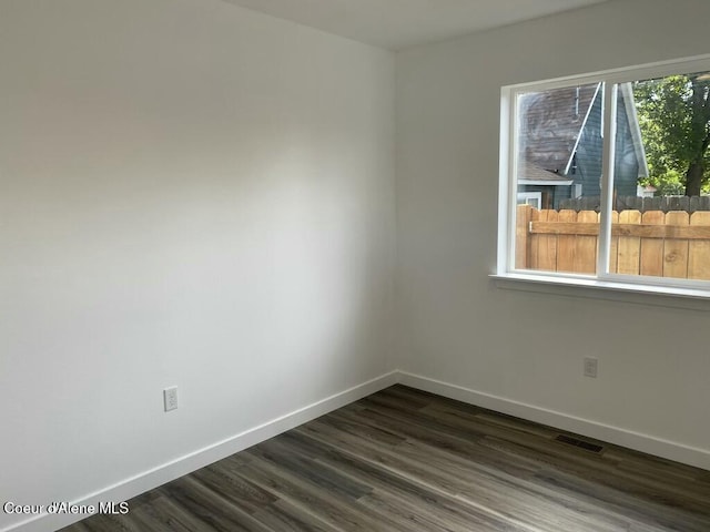 1412/1414 N 13th St, Coeur Dalene, ID 83814 - empty room with baseboards and dark wood-style flooring