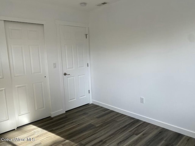 1412/1414 N 13th St, Coeur Dalene, ID 83814 - unfurnished bedroom with dark wood-style flooring