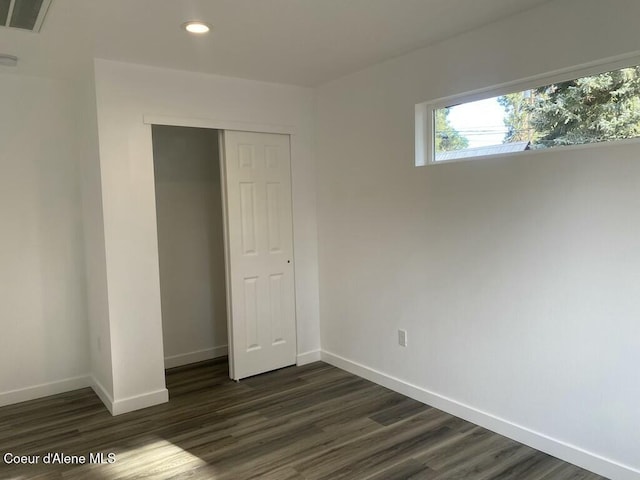 1412/1414 N 13th St, Coeur Dalene, ID 83814 - unfurnished bedroom featuring dark wood-style flooring, a closet, and recessed lighting