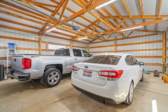 331 15th St, Plummer, ID 83851 - garage featuring a garage door opener and metal wall