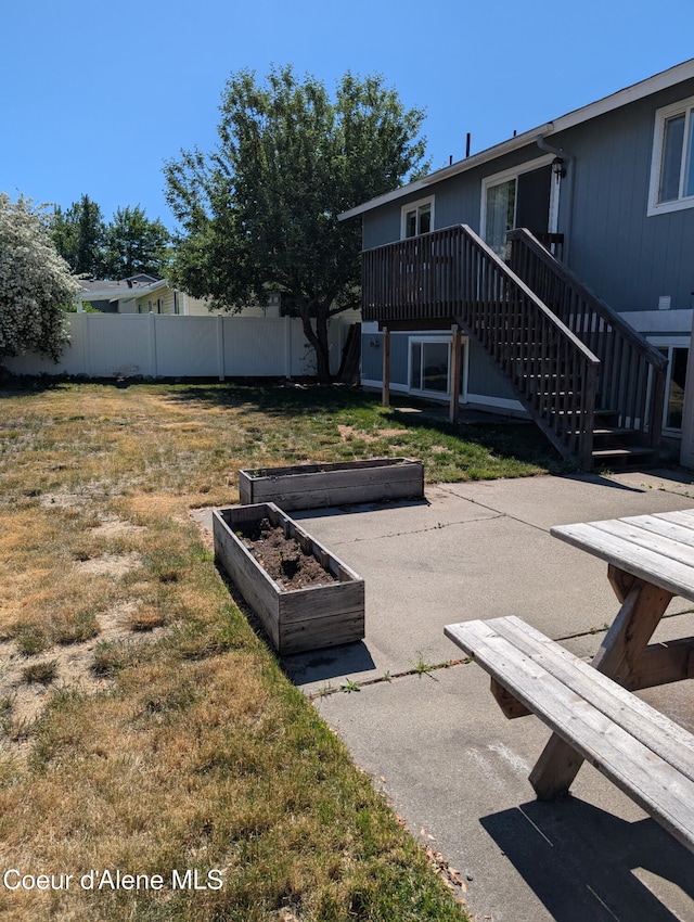 902 E Glacier Peak Dr, Post Falls, ID 83854 - view of community with stairway, a garden, and a wooden deck