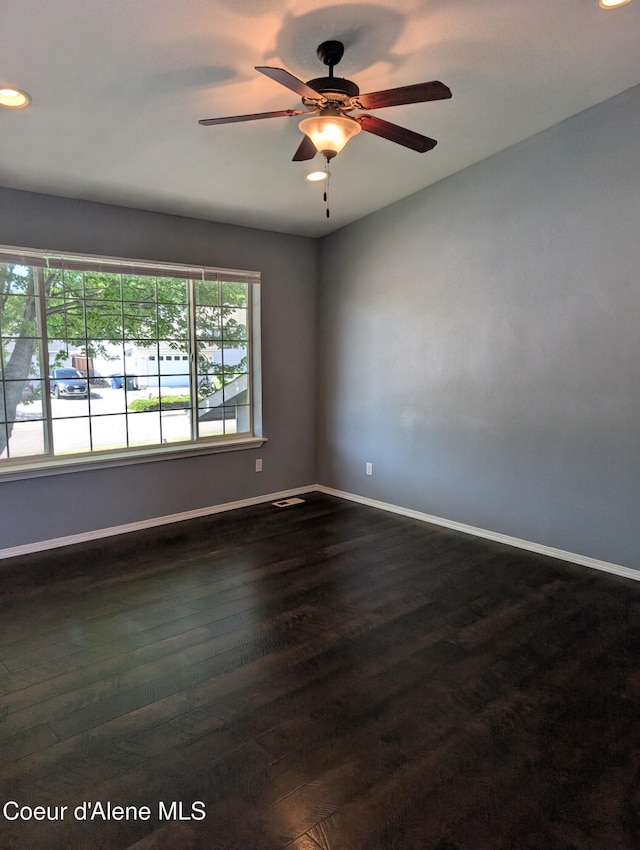 902 E Glacier Peak Dr, Post Falls, ID 83854 - empty room featuring baseboards, recessed lighting, dark wood-style flooring, and ceiling fan