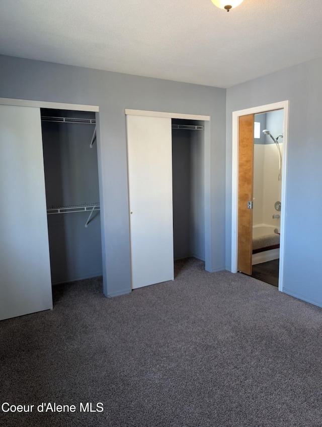 902 E Glacier Peak Dr, Post Falls, ID 83854 - unfurnished bedroom with multiple closets and carpet flooring