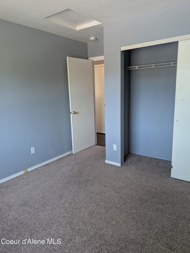 902 E Glacier Peak Dr, Post Falls, ID 83854 - unfurnished bedroom with carpet, a closet, and baseboards