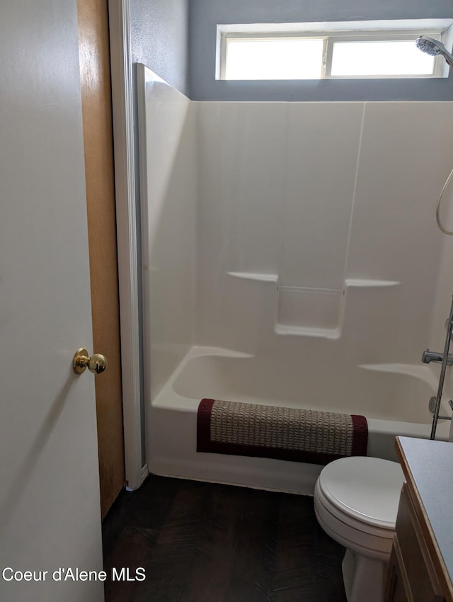 902 E Glacier Peak Dr, Post Falls, ID 83854 - bathroom featuring vanity, toilet, and tub / shower combination