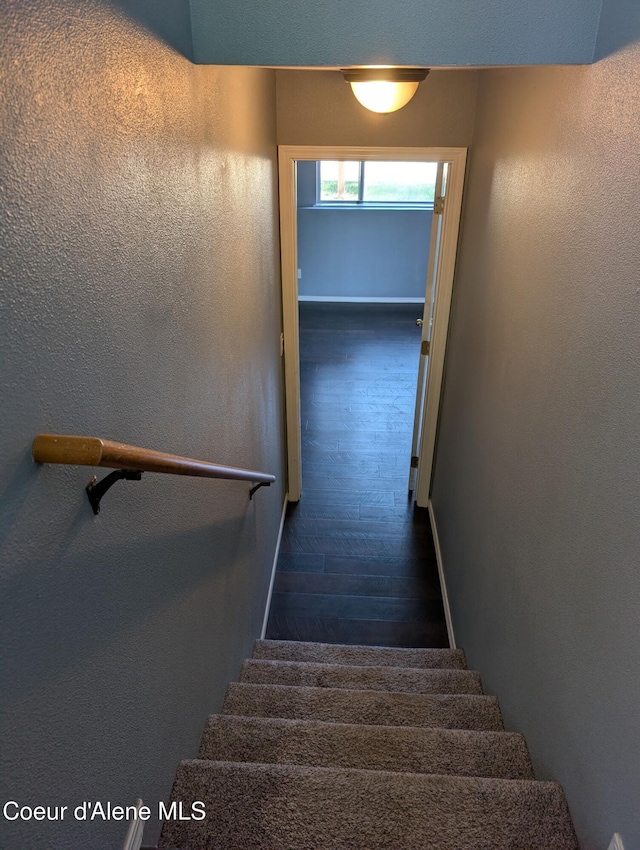 902 E Glacier Peak Dr, Post Falls, ID 83854 - stairs featuring baseboards, wood finished floors, and a textured wall