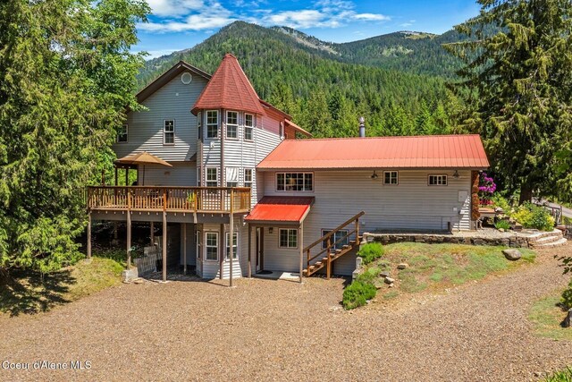 343 W Spring Creek Rd, Hope, ID 83836 - back of house featuring a deck with mountain view, a wooded view, stairway, and metal roof