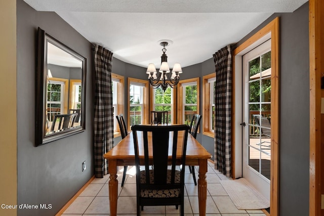 343 W Spring Creek Rd, Hope, ID 83836 - dining room with a chandelier, light tile patterned floors, and baseboards