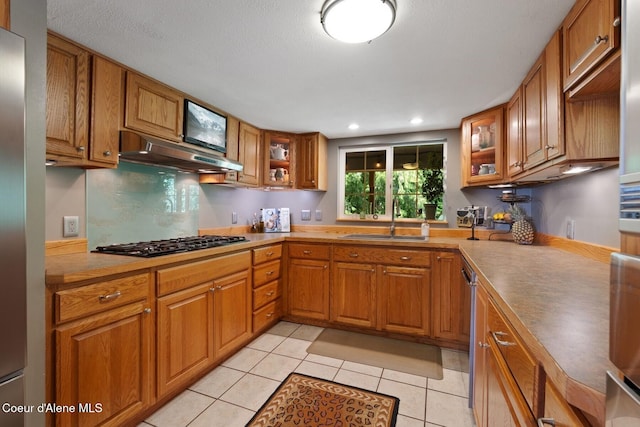 343 W Spring Creek Rd, Hope, ID 83836 - kitchen with a sink, under cabinet range hood, brown cabinetry, black gas stovetop, and recessed lighting