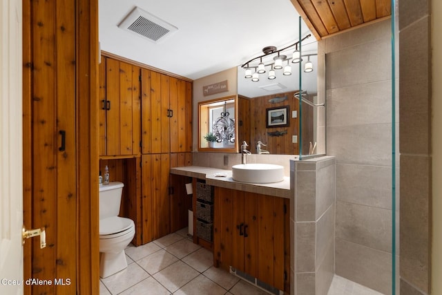 343 W Spring Creek Rd, Hope, ID 83836 - full bathroom featuring vanity, toilet, tile patterned floors, and a tile shower