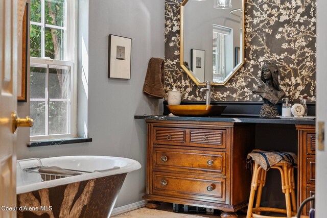343 W Spring Creek Rd, Hope, ID 83836 - bathroom with a soaking tub, wallpapered walls, and vanity