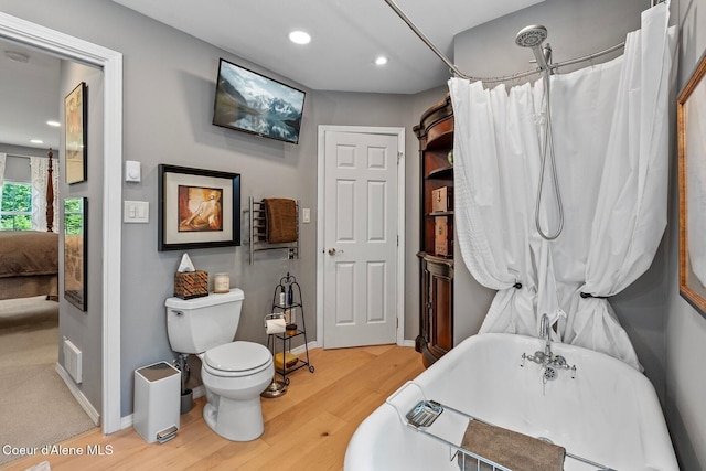 343 W Spring Creek Rd, Hope, ID 83836 - ensuite bathroom with wood finished floors, a freestanding bath, recessed lighting, toilet, and baseboards