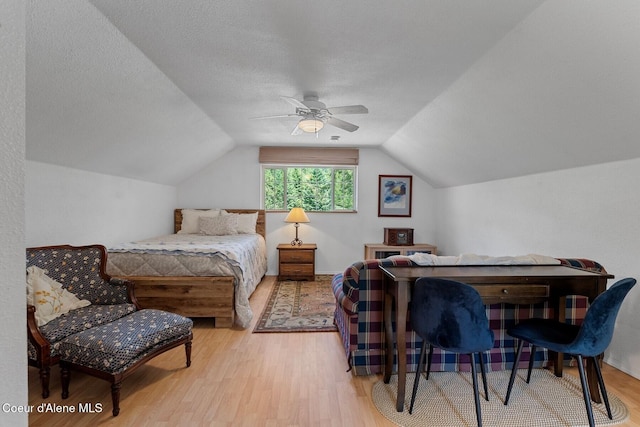343 W Spring Creek Rd, Hope, ID 83836 - bedroom featuring wood finished floors, lofted ceiling, ceiling fan, and a textured ceiling