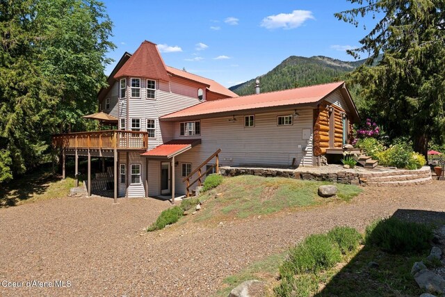 343 W Spring Creek Rd, Hope, ID 83836 - back of property with a deck with mountain view, metal roof, and stairs