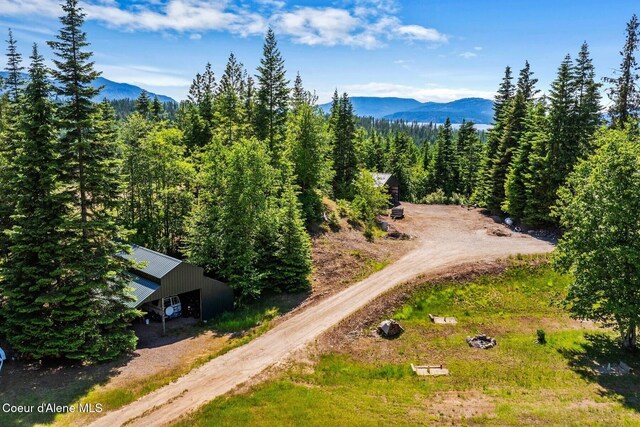 343 W Spring Creek Rd, Hope, ID 83836 - view from above of property featuring mountains and a heavily wooded area