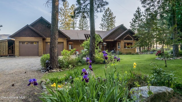 75 Windy Ln, Moyie Springs, ID 83845 - cabin with an attached garage, a front yard, and dirt driveway