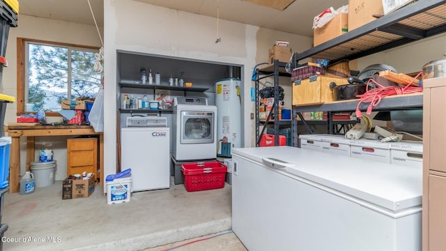 75 Windy Ln, Moyie Springs, ID 83845 - garage with washing machine and clothes dryer, water heater, and fridge
