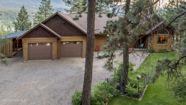 75 Windy Ln, Moyie Springs, ID 83845 - view of front of property with gravel driveway and a garage