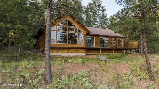 75 Windy Ln, Moyie Springs, ID 83845 - back of property with central air condition unit and a deck