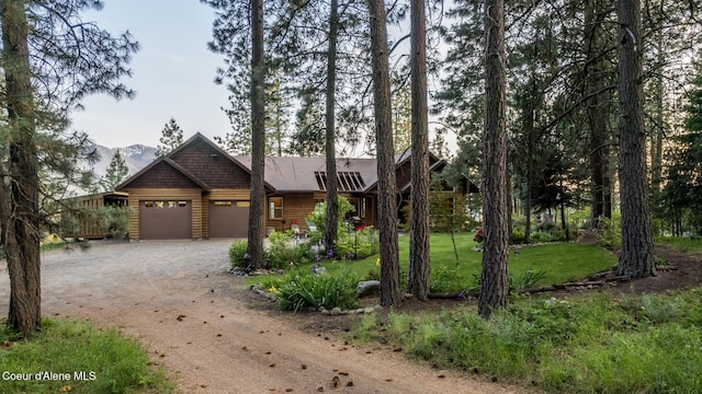 75 Windy Ln, Moyie Springs, ID 83845 - view of front of property with dirt driveway, an attached garage, and a front yard
