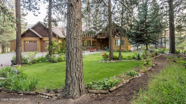 75 Windy Ln, Moyie Springs, ID 83845 - view of front of property featuring a front yard, driveway, and a garage