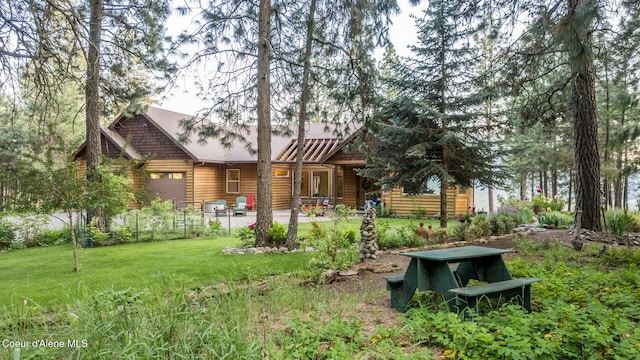 75 Windy Ln, Moyie Springs, ID 83845 - back of property featuring a yard and a garage