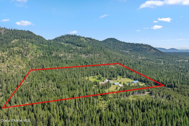 26277 N Chevrolane Way, Rathdrum, ID 83858 - aerial view of property and surrounding area featuring a mountainous background and property parcel outlined