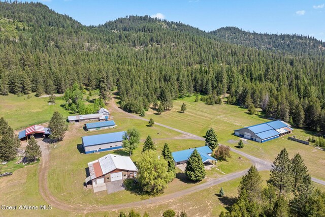 26277 N Chevrolane Way, Rathdrum, ID 83858 - aerial view of a heavily wooded area and a mountain backdrop