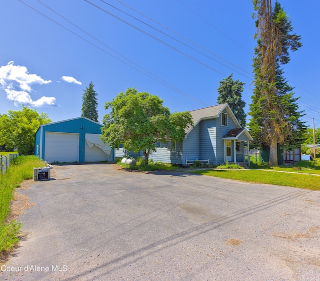 464 E Lincoln, Priest River, ID 83856 - view of front of house with a garage and an outdoor structure