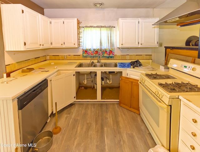 464 E Lincoln, Priest River, ID 83856 - kitchen featuring gas range gas stove, range hood, stainless steel dishwasher, a sink, and white cabinets